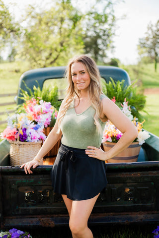 Skort with elastic waists and a drawstring. Looks like a skirt but has shorts underneath. 