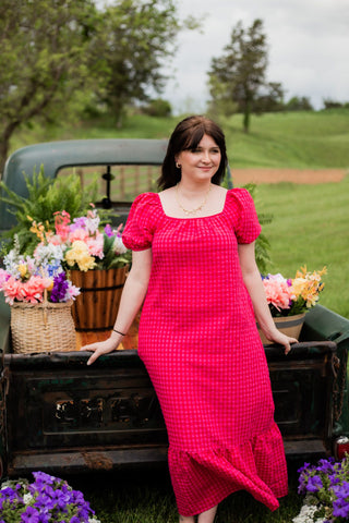 This a line dress with red and pink pattern are perfect for all your spring events. The ruffle sleeves add a touch of elegance. 