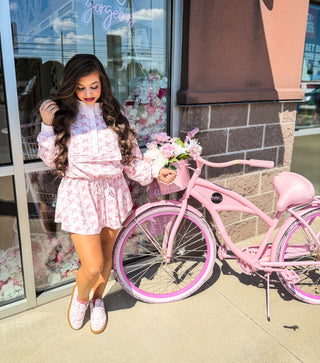Waffle knit with bow and floral design. Long sleeve shirt and skort 