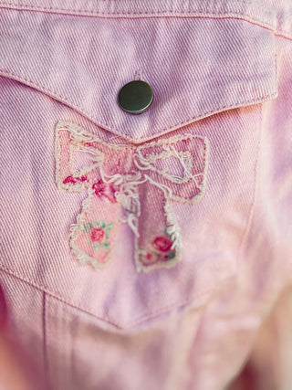Light weight embroidered jacket with floral and bow design. 