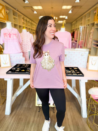 
Coquette ghost tee with lace floral details and bow on lavender shirt—girly feminine Halloween graphic tee for soft spooky style.