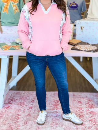 Floral detail on arms to waist. Girly pullover with color block details. 