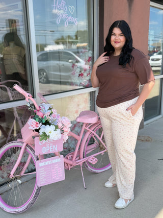 Plus size cream colored floral sweatpants 