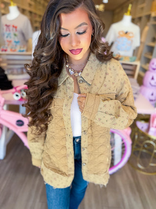 Quilted shacket with pockets and floral design. Available in cream or mocha. 