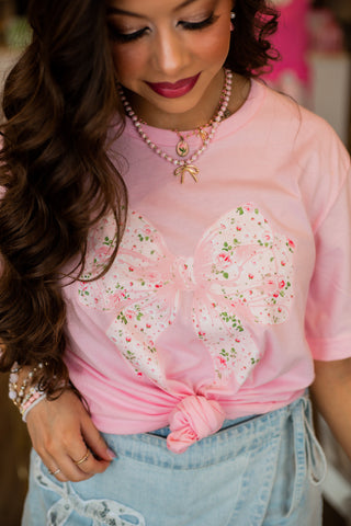 Graphic tee with bow. 