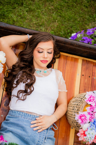 This top is sheer perfection. Its white lace is perfect to level up any outfit. 