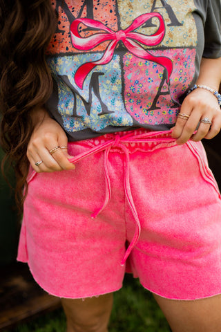 Sweet shorts in blue or pink. Super soft with an elastic waist and pockets. 