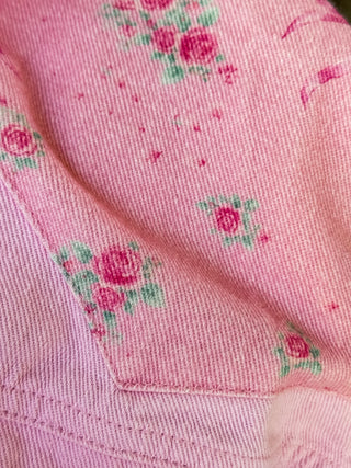 Light weight embroidered jacket with floral and bow design. 