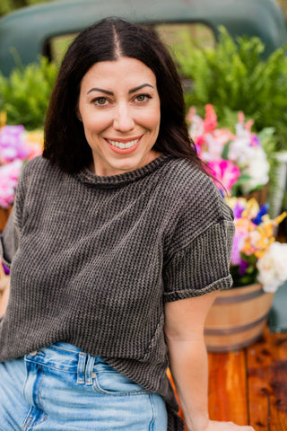 Black acid wash waffle knit top with short cuffed sleeves  