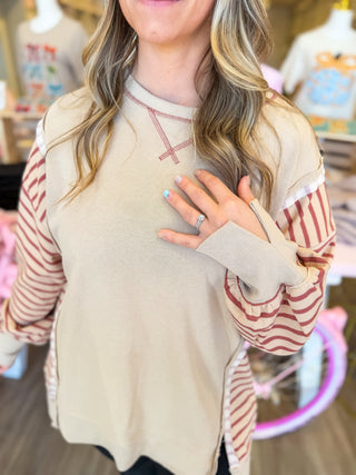 Tan color block pullover with raw hem detail. Cozy and perfect with jeans or leggings. 