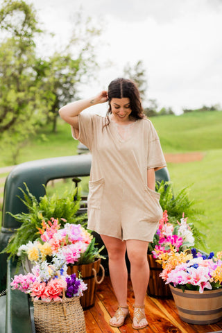 A romper with a deep v neck and oversized fit. Pockets and an above the knee length gtg but not too short! 