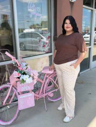 Plus size cream colored floral sweatpants 