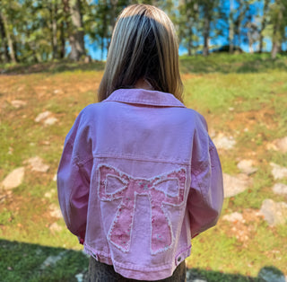 Light weight embroidered jacket with floral and bow design. 