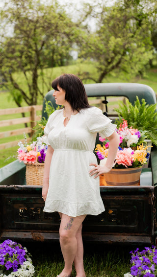 Spring dress with light fabric and flurry details perfect for brides or graduates. 