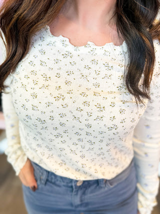 Sweet Meadow Long Sleeve Top in cream with dainty green and blue floral print, ribbed knit fabric, and lettuce-trim 