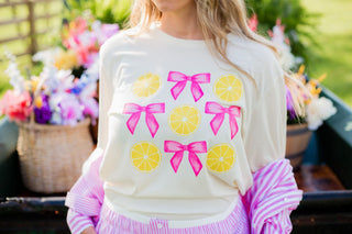 Graphic tee with lemons and bows pink. 