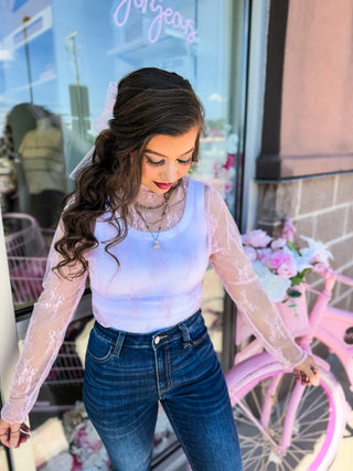 Romantic sheer lace long sleeve top layered over a ribbed tank. Available in pink & blue at Bailey Kate Boutique. Perfect for date nights, girls’ night out, or everyday chic.
